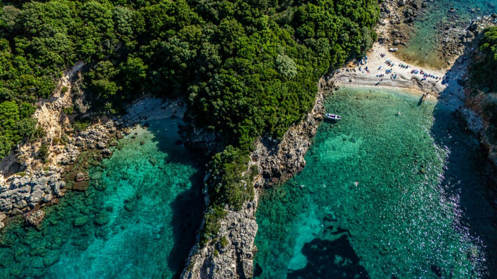 Explore corfu by boat crystal turquoise waters of Paleokastritsa