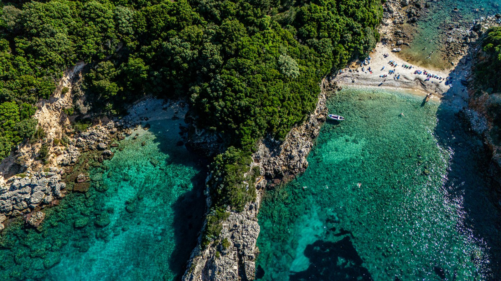 Explore corfu by boat crystal turquoise waters of Paleokastritsa